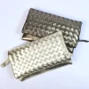Pochette morbida intrecciata pelle laminata art 1719wmet